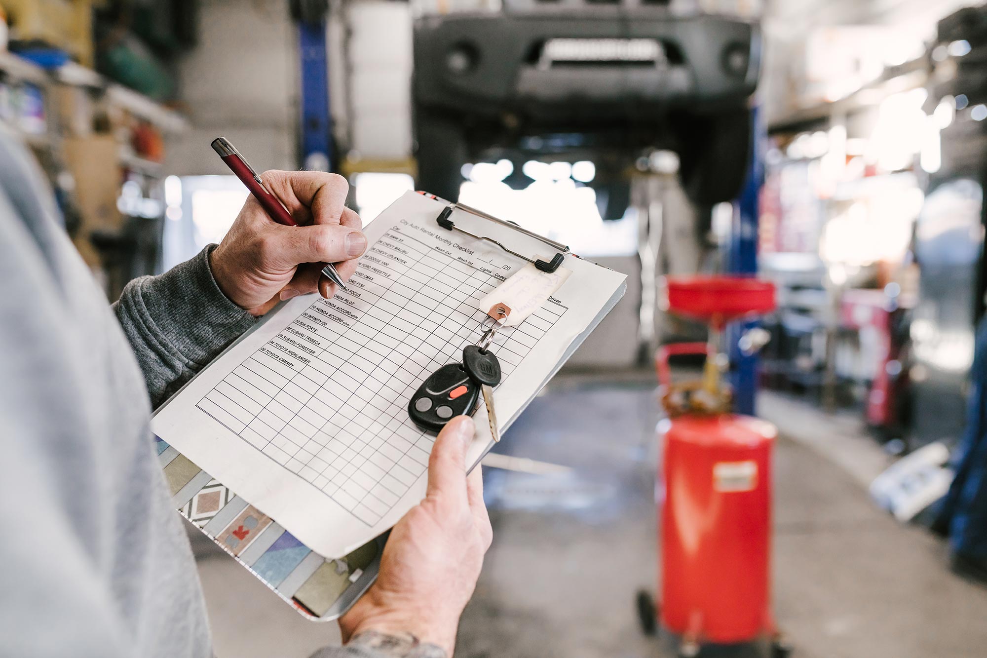 City Auto Body team member reviewing collision damage with a customer